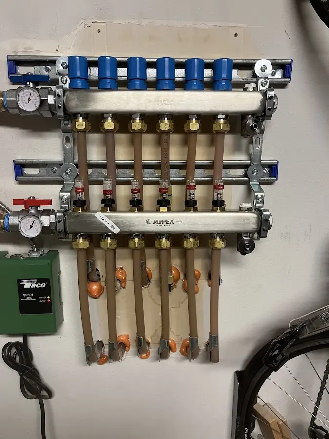 Plumber performing Water Heater Repair at a residential property in St. Francis